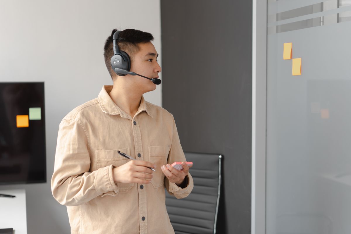 Sales executive on a headset call to a clinic — careers at MedicalMet